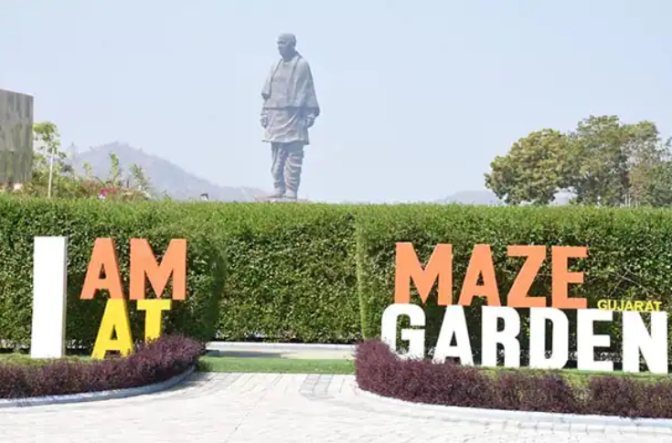 statue of unity in background with I AM AT MAZE GARDEN GUJARAT text